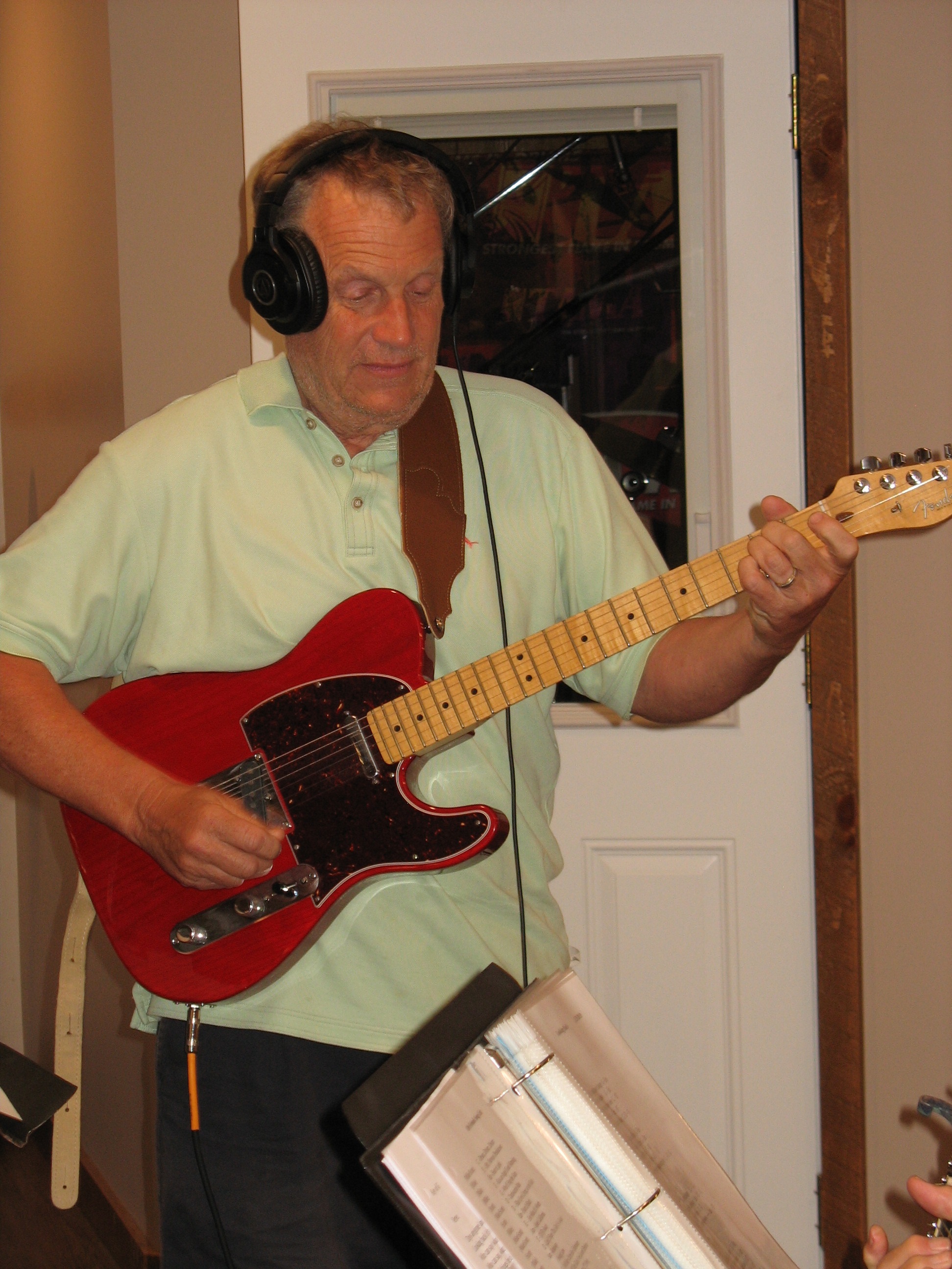 Client playing electric guitar